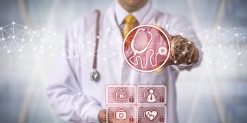 Unrecognizable diagnostician is using a virtual stethoscope in a medical support system. Healthcare concept for telemedicine, investigation and identification of disease via apps and connectivity.