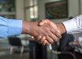 two business men shaking hands; partnership marketing