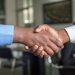 two business men shaking hands; partnership marketing