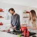 a couple cooking on their stove; home for your family on a budget