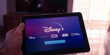 Barcelona, Spain. Jan 2019: Man holds a tablet with the new Disney plus on screen . Disney+ is an online video streaming subscription service.Illustrative